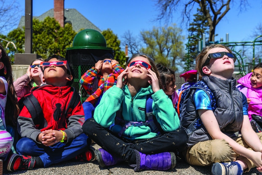 'Nature's hole in one' Woodstock residents celebrate the solar eclipse ...